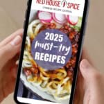a mobile phone screen showing red house spice website with a noodle dish picture.