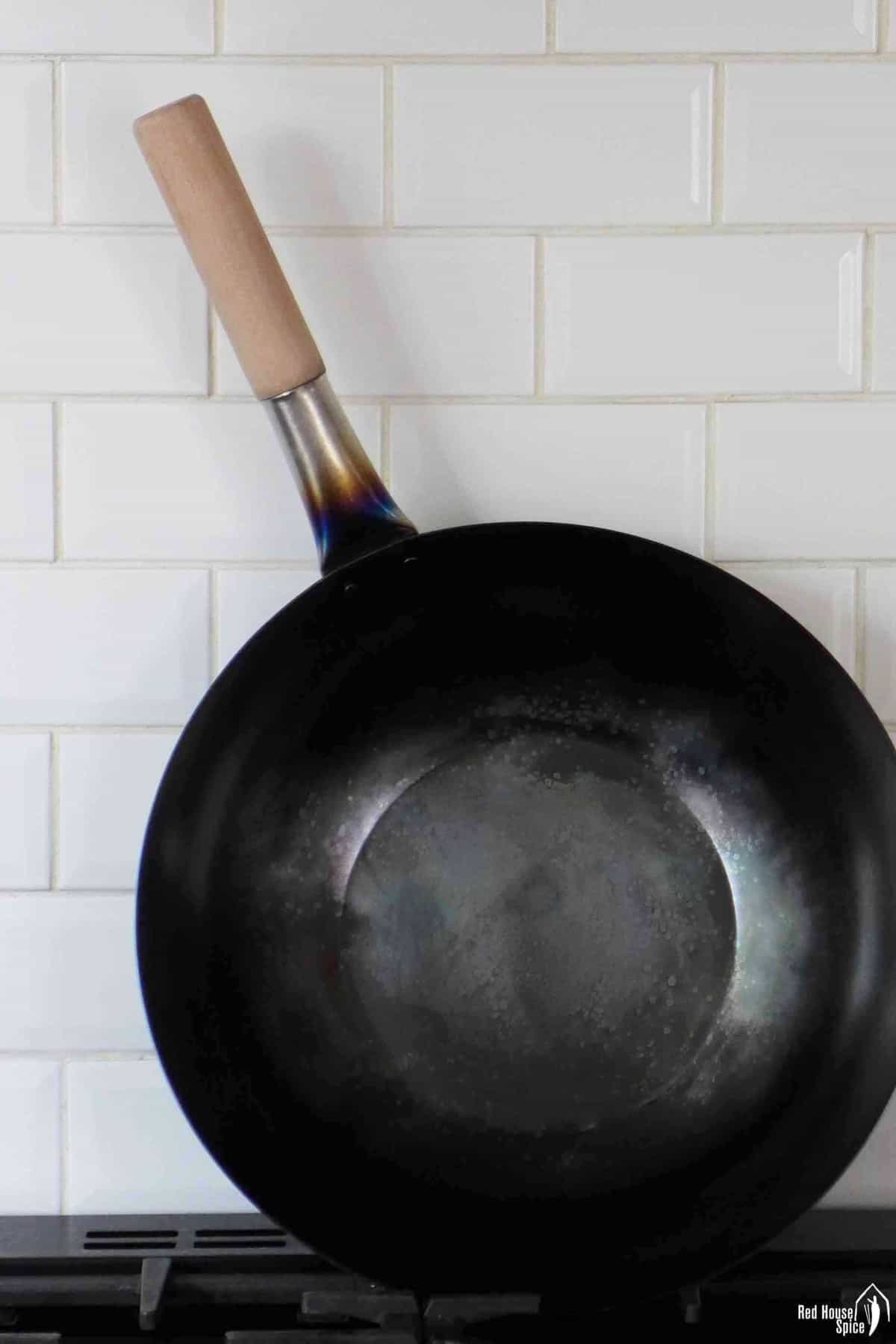 a seasoned carbon steel wok