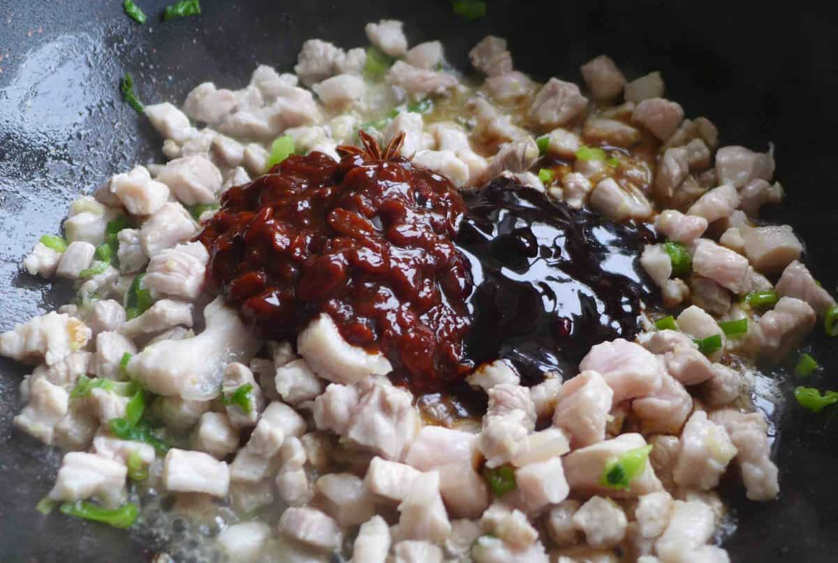 adding sauces to pork.
