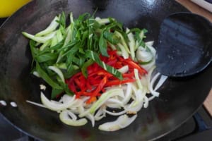 bok choy and chili pepper in wok.