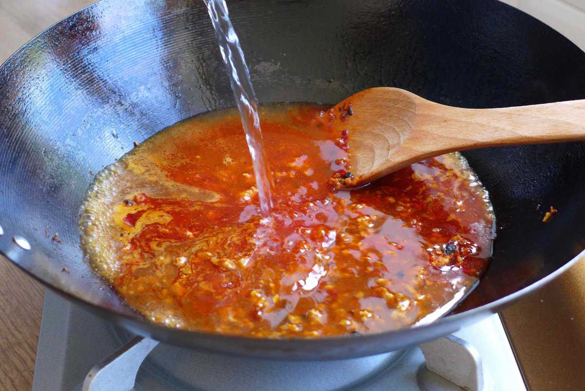 adding water to a wok
