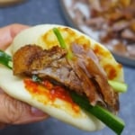 Aromatic crispy duck wrapped with a steamed bao bun.