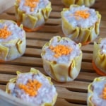 uncooked Siu Mai in a bamboo steamer basket.