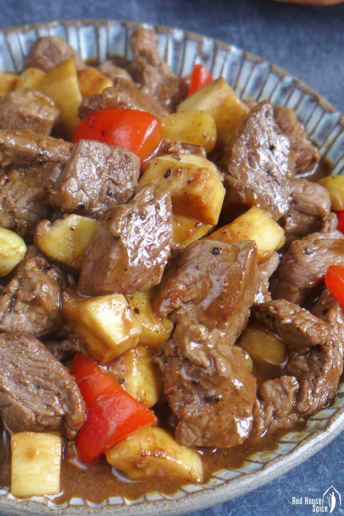 A plate of beef and mushroom stir-fry.