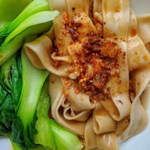 Hand-pulled Biang Biang Noodles with Bok Choy and spicy dressing.