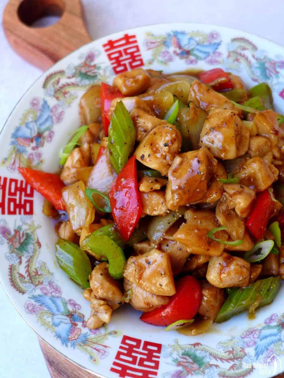 A plate of black pepper chicken stir-fry