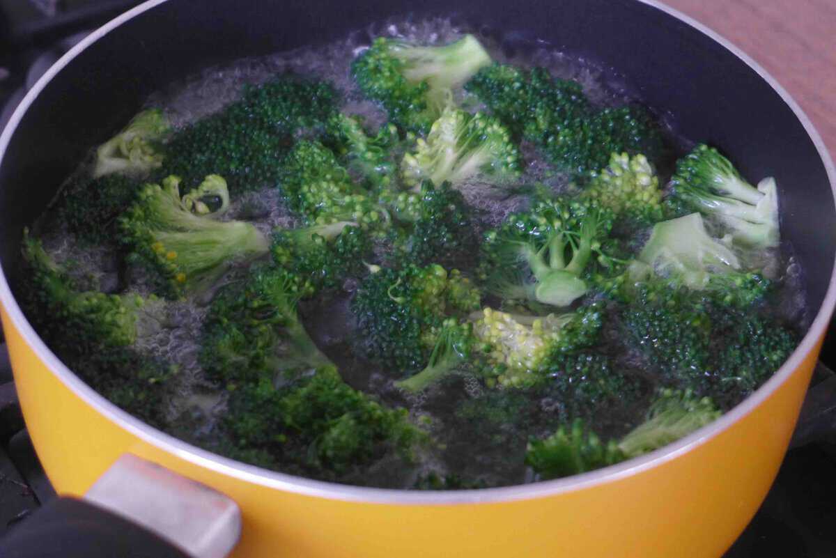 blanching broccoli in boiling water.