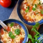 Two bowls of tomato egg drop soup.