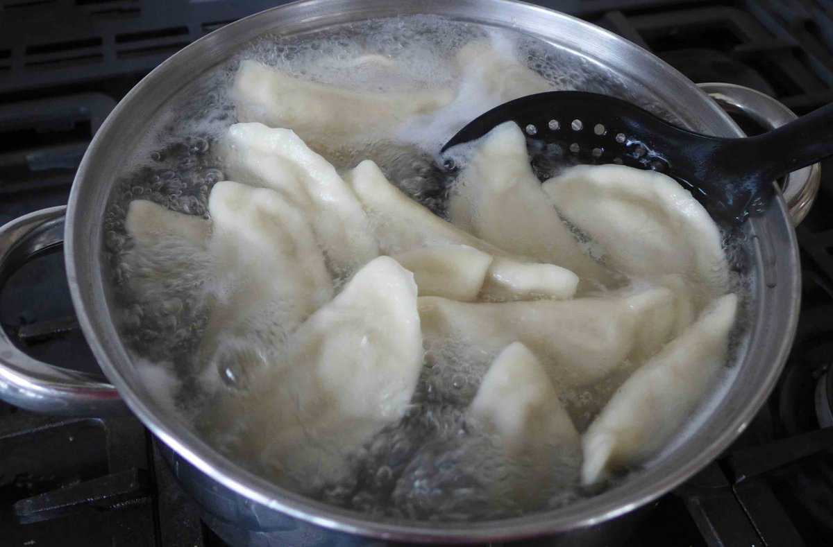 boiling dumplings in a pot.