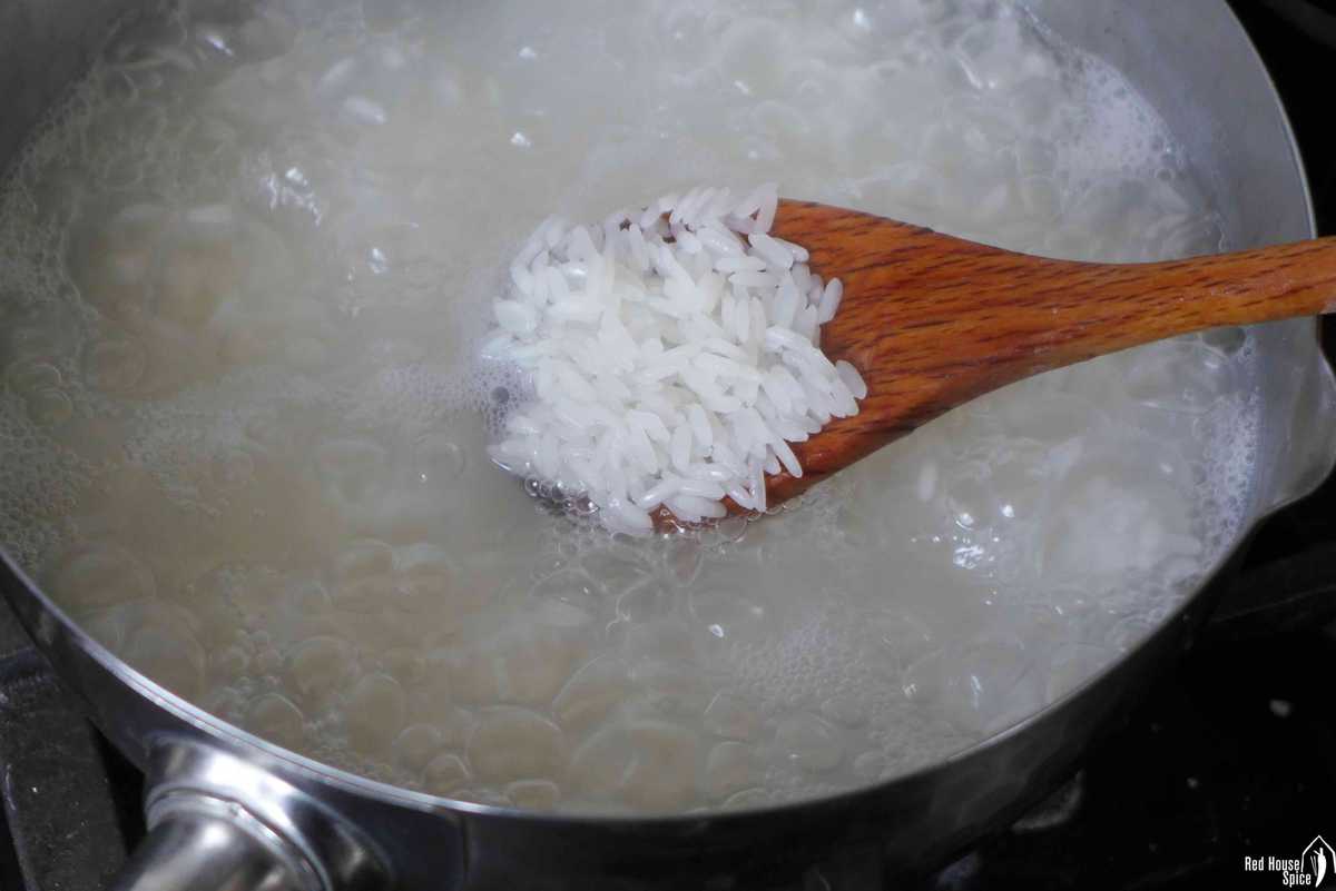 boiling jasmine rice in water.