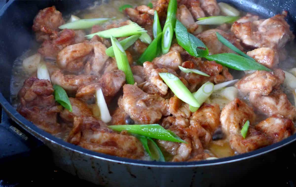 braising chicken with scallions.