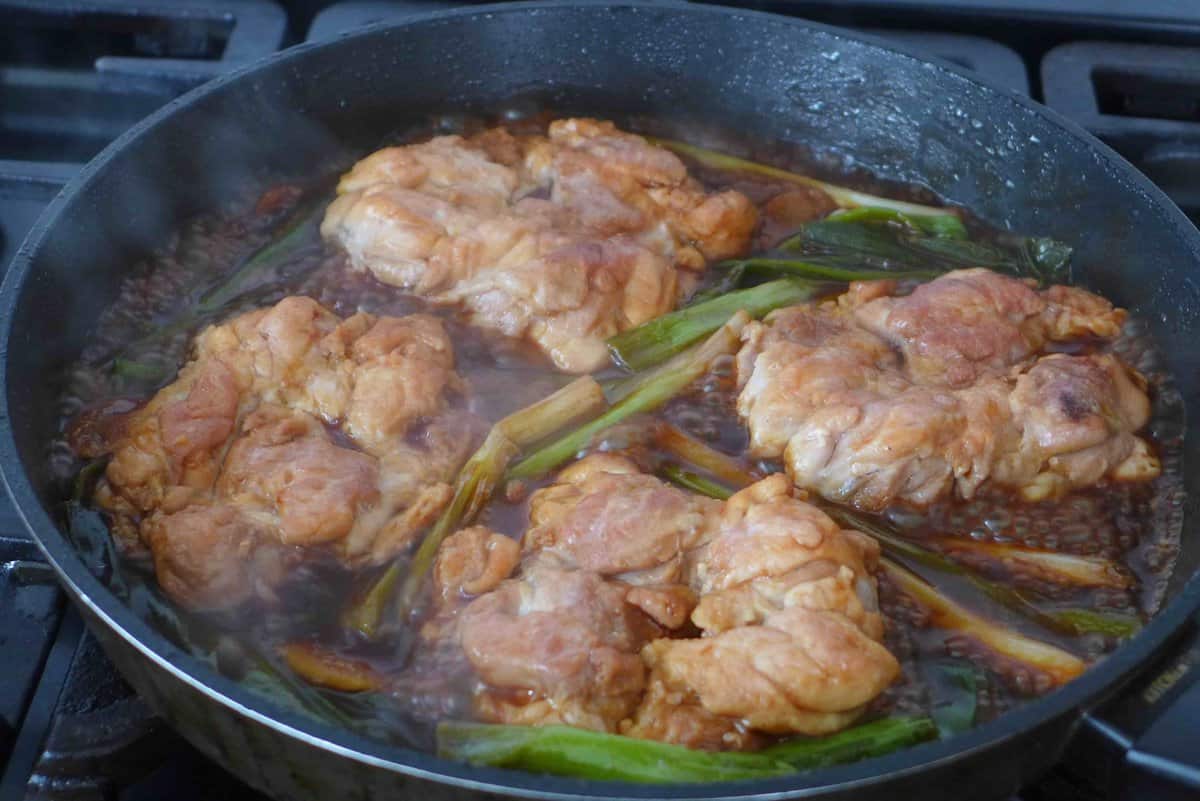 Sauce bubbling around chicken.