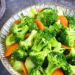 stir-fried broccoli and carrot with overlay text that says broccoli stir-fry.
