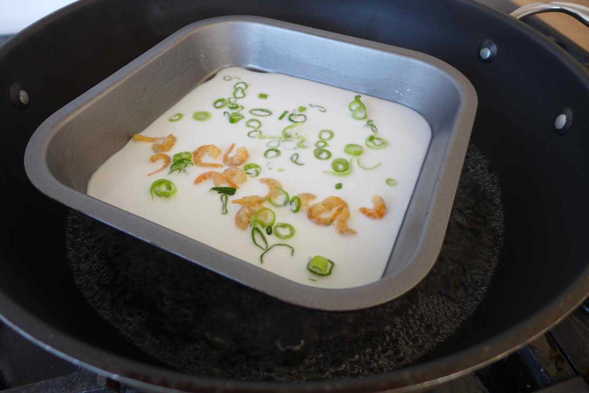 Cheung fun batter and fillings in a tray