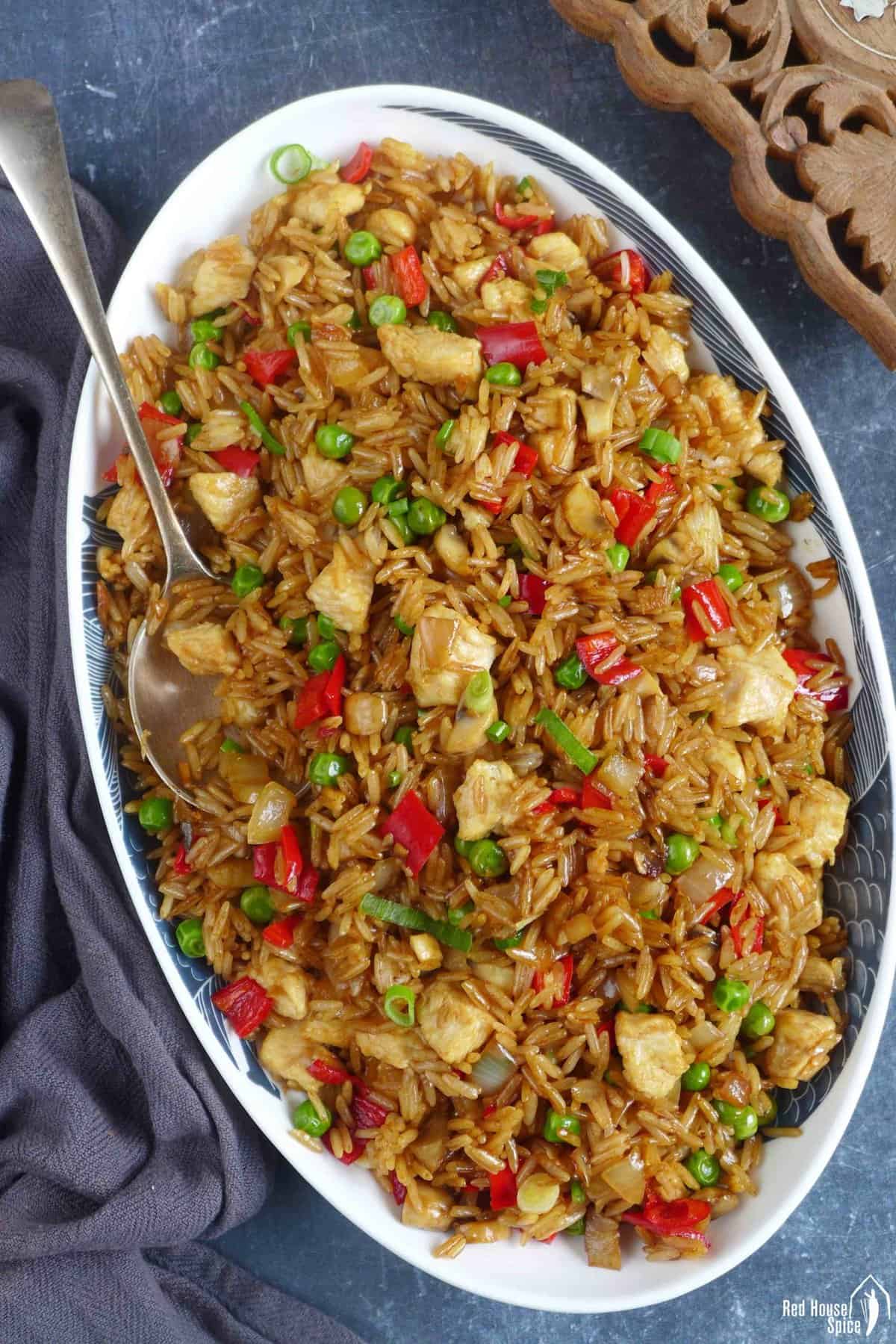 chicken fried rice in a plate.