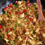 fried rice with chicken and vegetables with overlay text that says chicken fried rice.