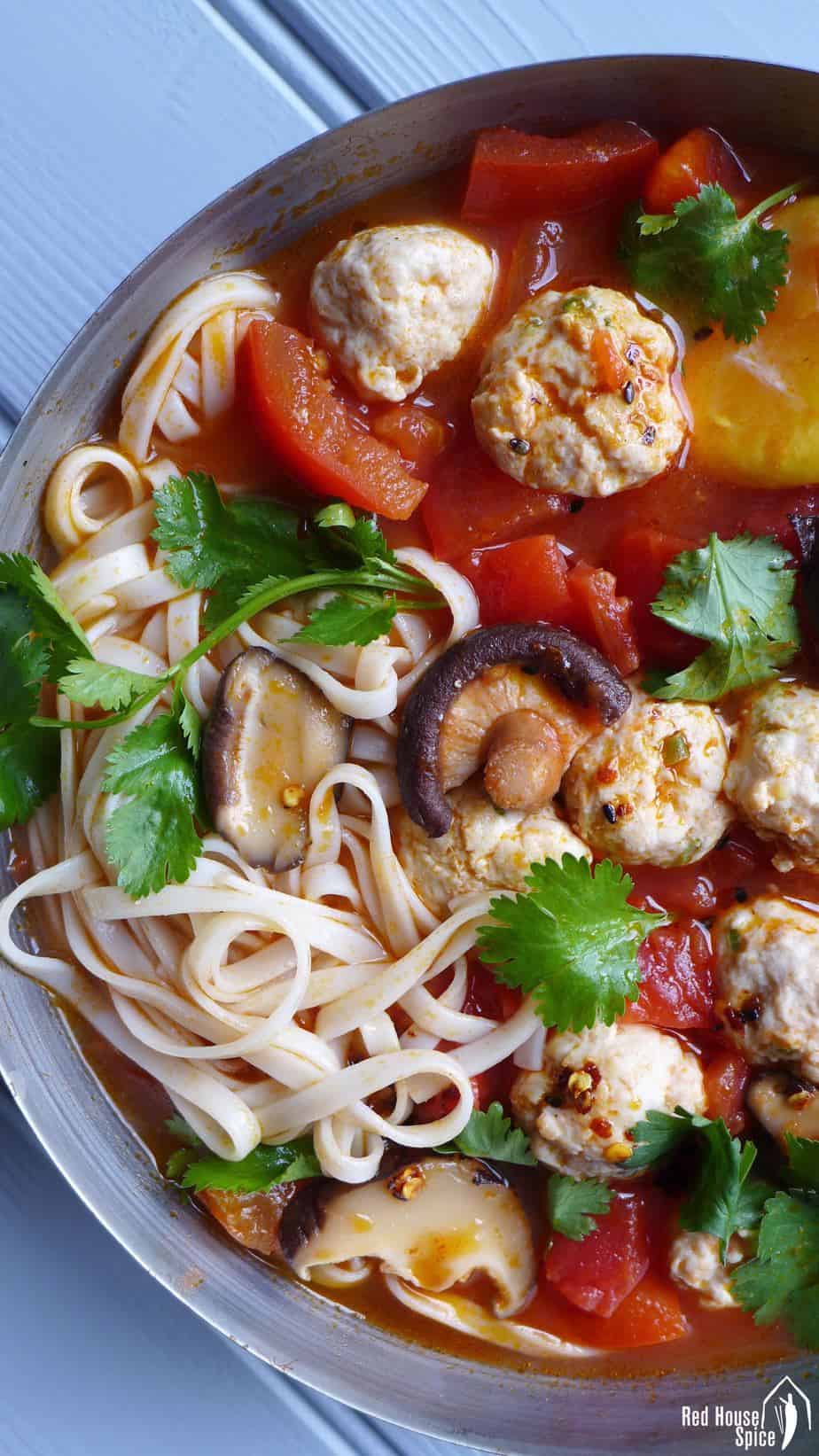 Tender and springy meatballs cooked in tomato and shiitake soup. This chicken meatball noodle soup is super tasty, filling and healthy.