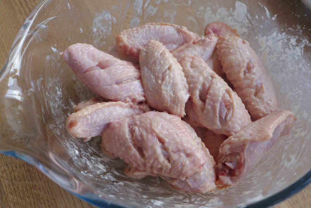 coating chicken wings with cornstarch.