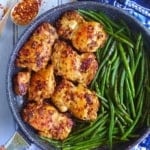 chili cumin chicken thighs and green beans in a skillet.