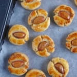 Chinese almond cookies on a baking tray.
