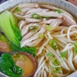shredded chicken, noodles, mushroom and Bok Choy in soup.