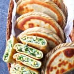 pan-fried, flat dumplings filled with chives, eggs and vermicelli with overlay text that says Chinese chive pockets.