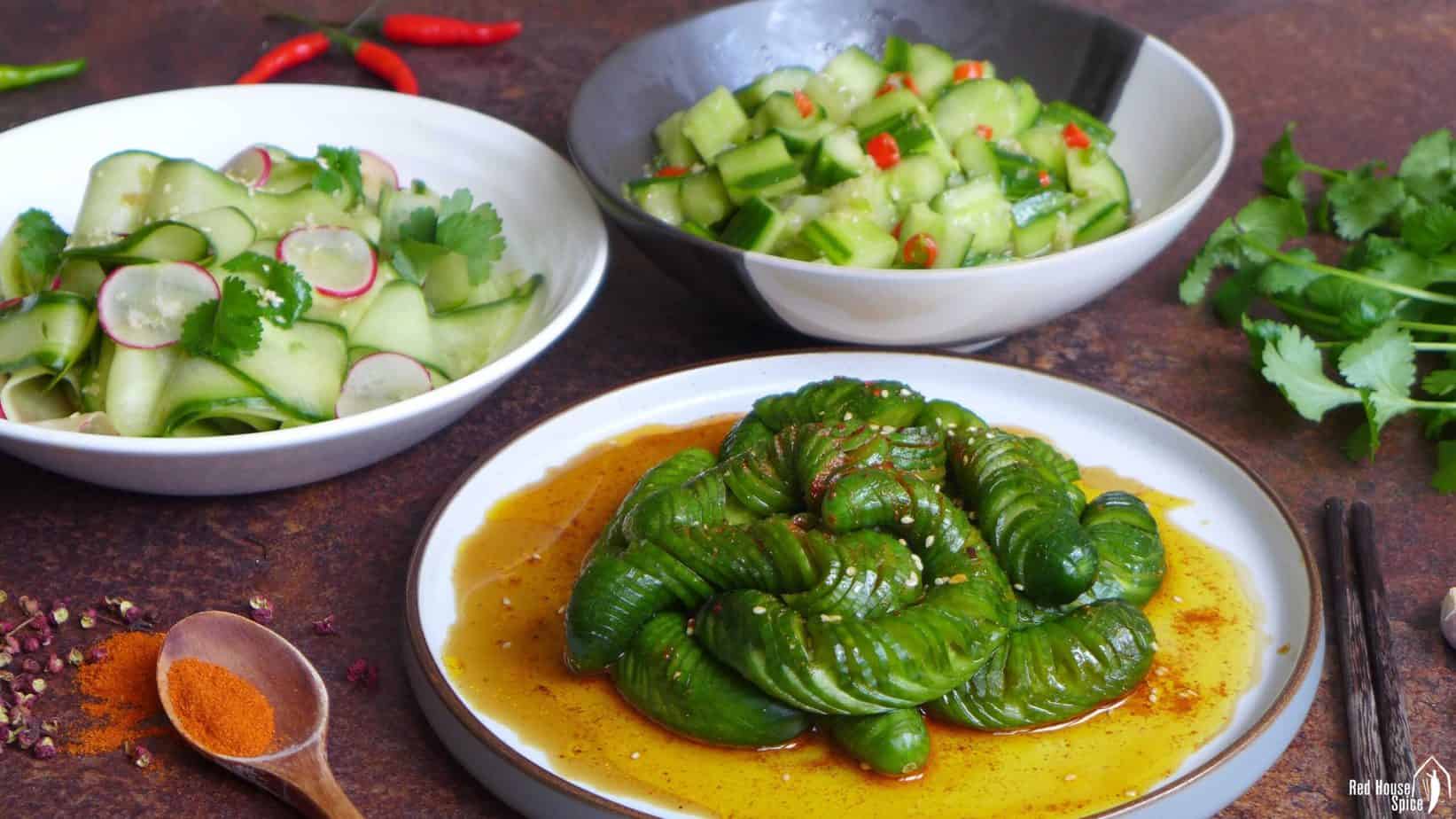 Three plates of cucumber salad