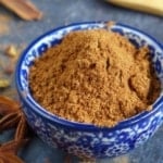 Homemade Chinese five spice powder in a bowl with overlay text that says homemade five-spice.