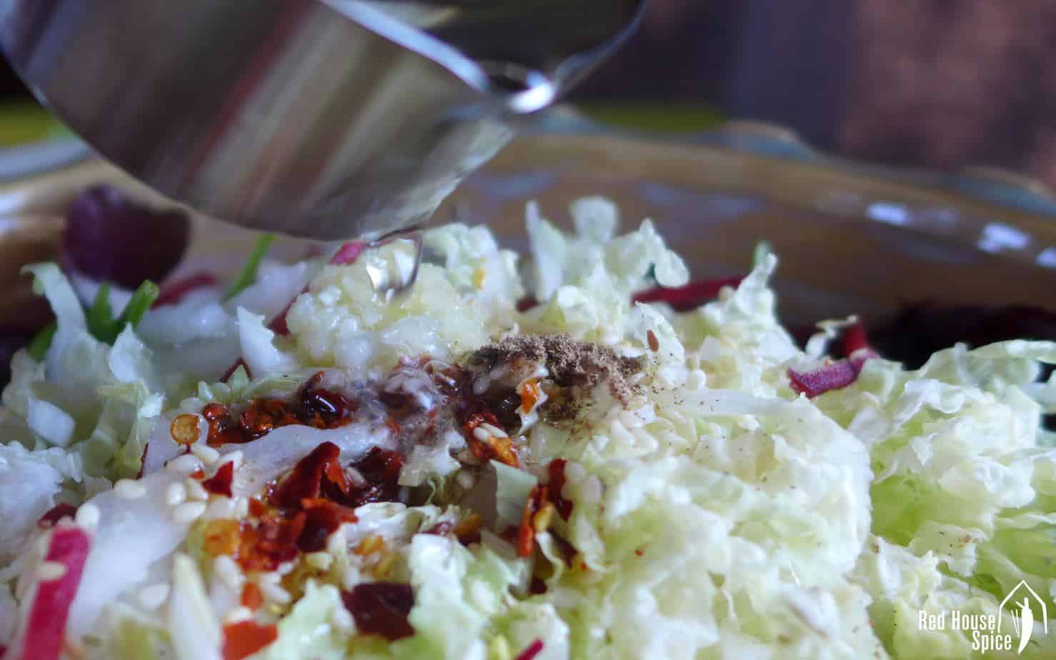 Pouring oil on Napa cabbage