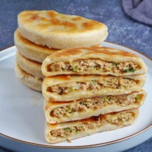 halved Chinese meat pies.