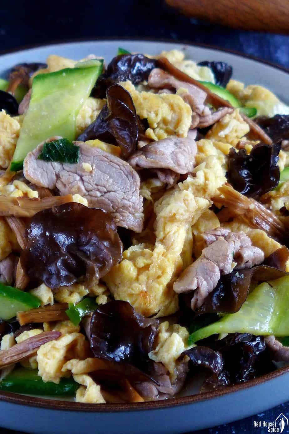 Pork fried with egg and vegetables