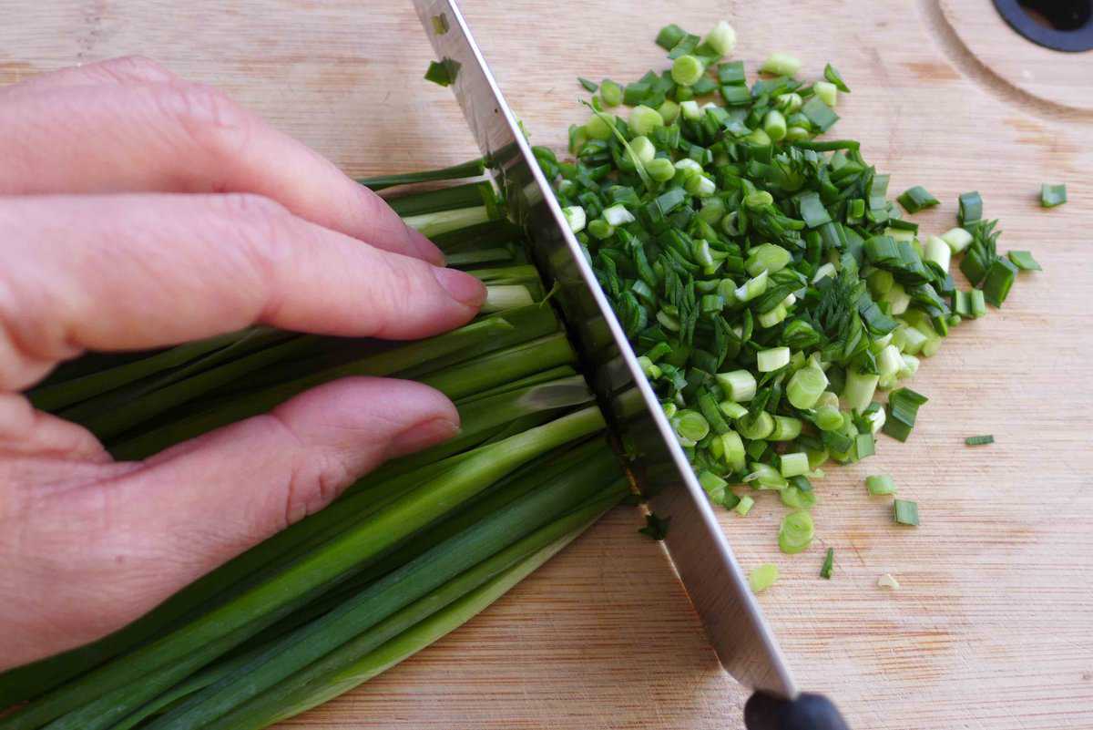 chopping Chinese chives.