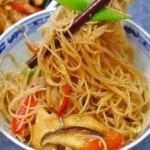chow mei fun picked up by chopsticks.