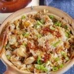 scorched rice and chicken in a clay pot.
