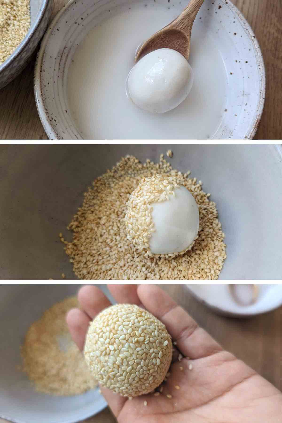 coating a dough ball with sesame seeds.