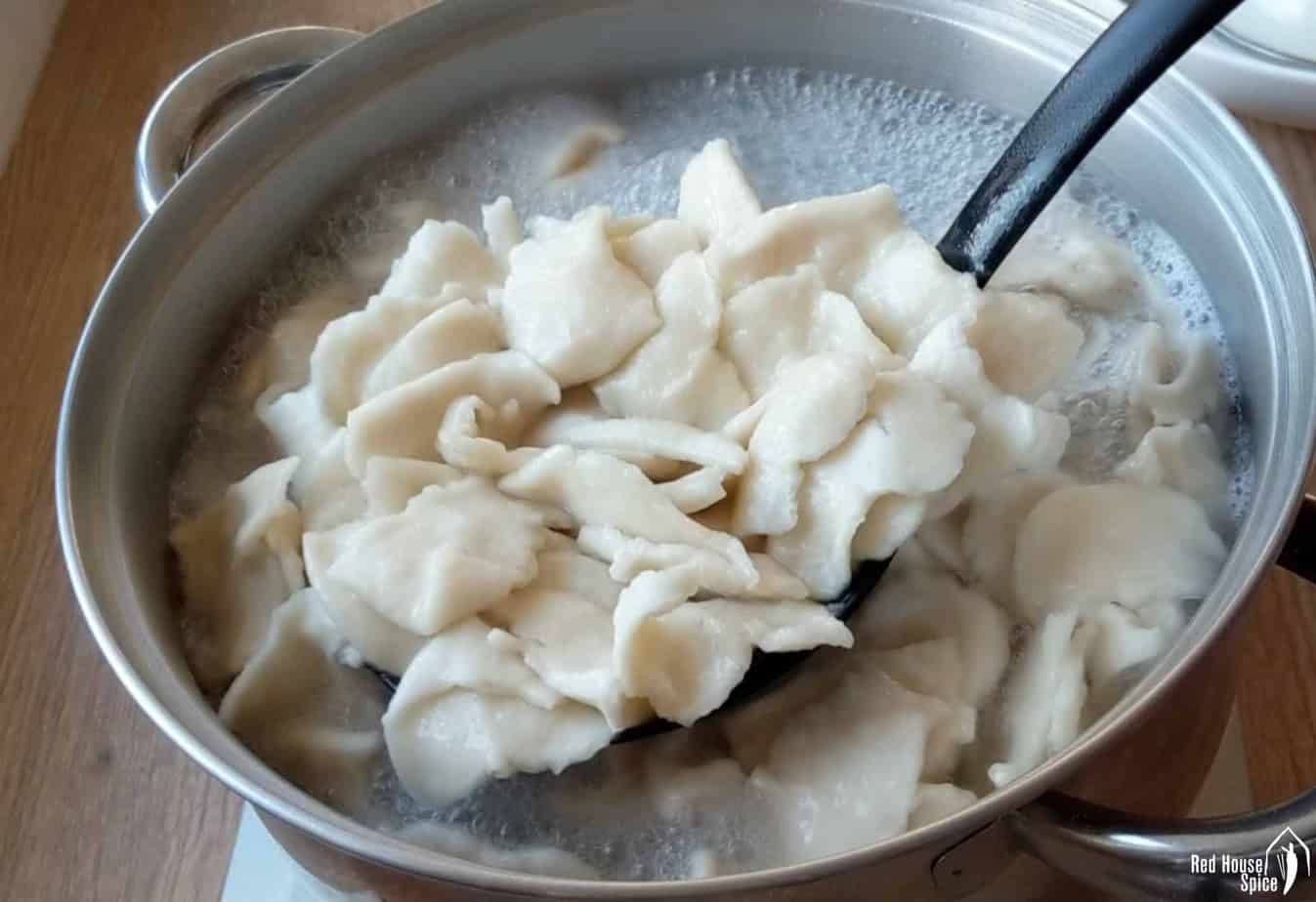 cooking hand-torn noodles in water