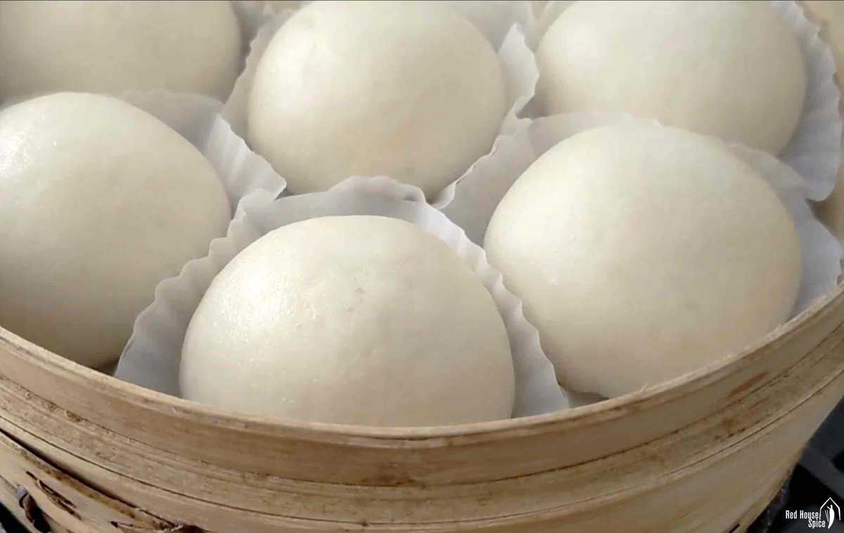 cooked round buns in a steamer