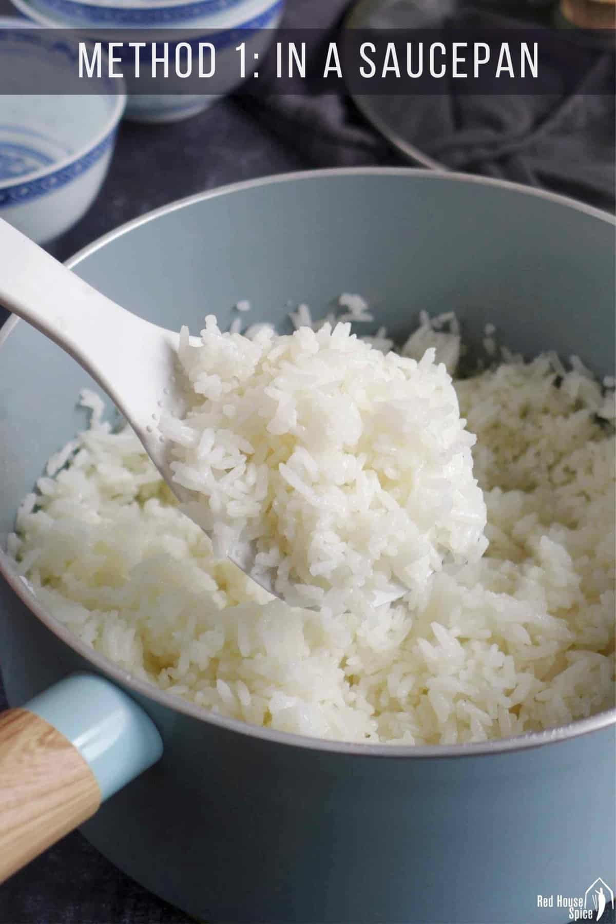Cooked jasmine rice in a saucepan.