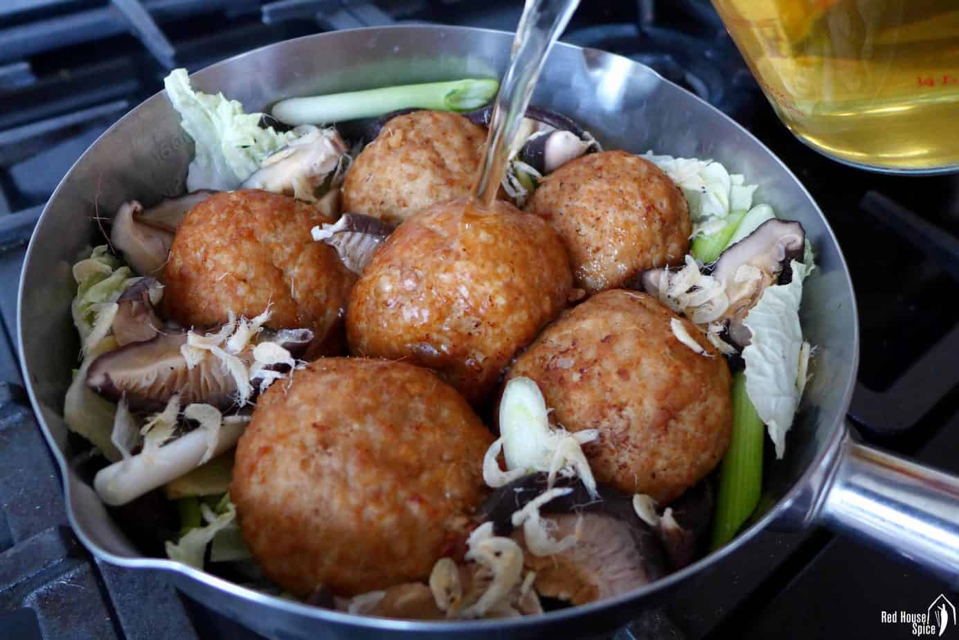 Cooking pork meatballs with cabbage and musroom