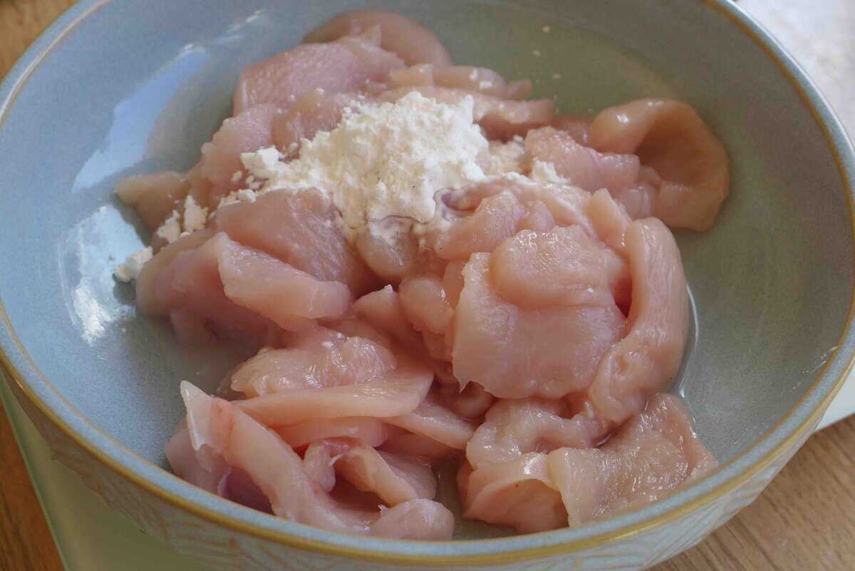 cornstarch over sliced chicken.