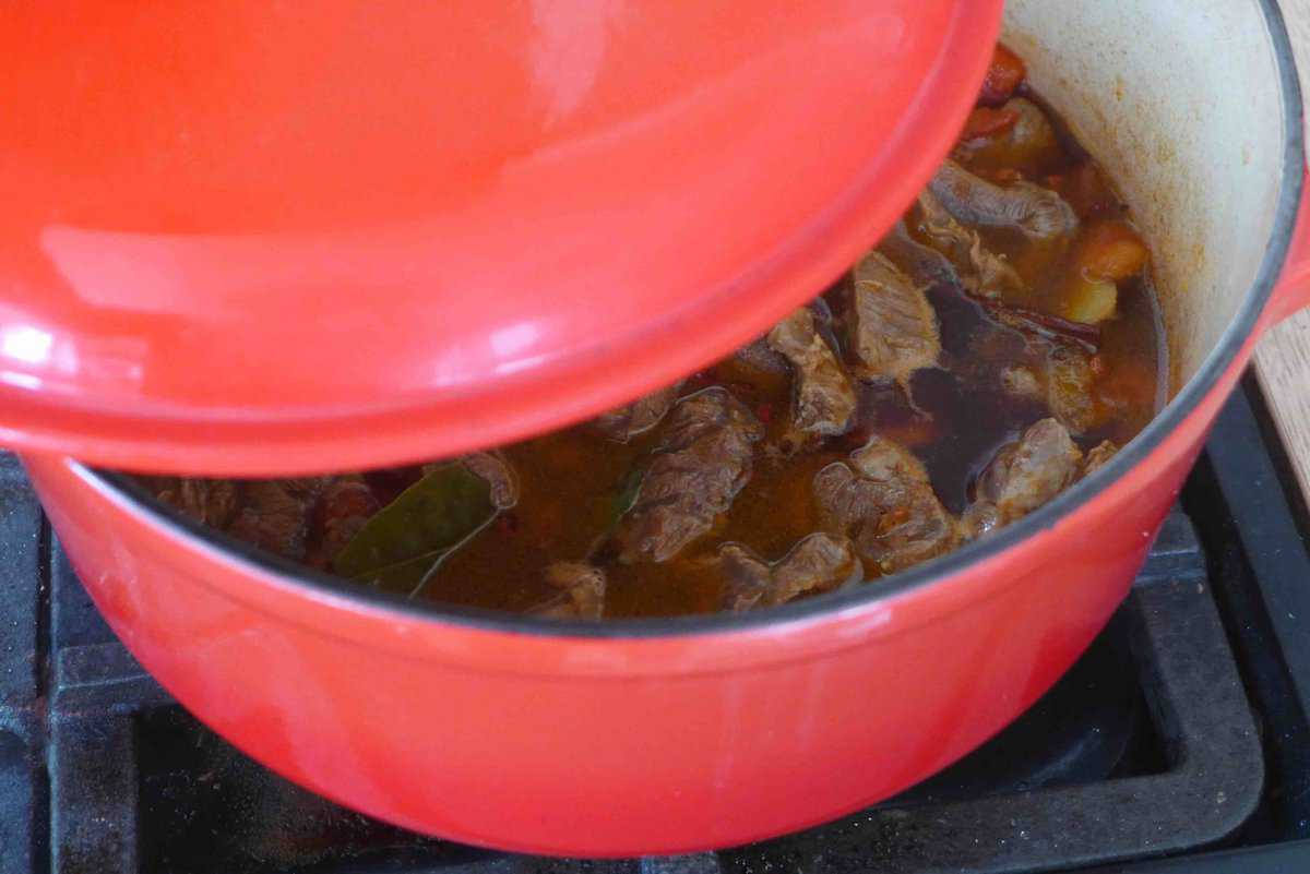 putting a lid onto a pot.