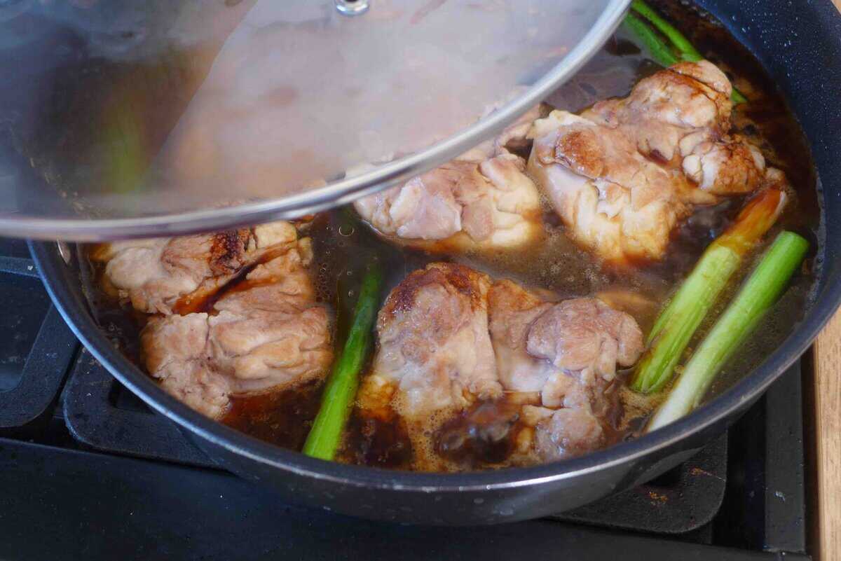 covering a skillet with lid.