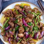 a plate of Xinjiang cumin lamb stir-fry.