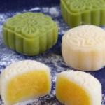 Mooncakes with one cut in halves with overlay text that says snow skin mooncakes.