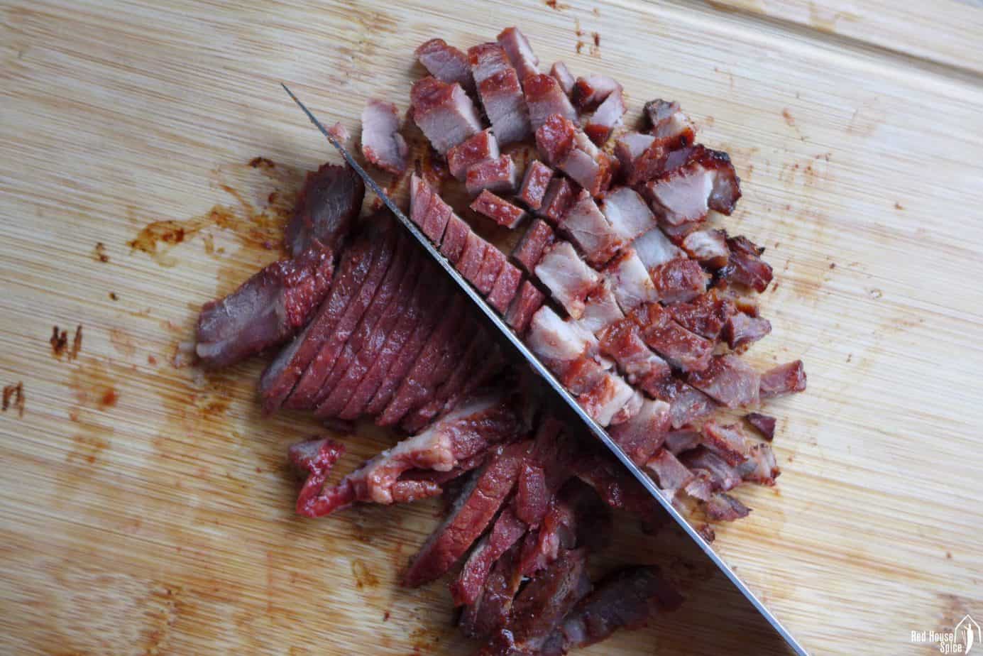 Cutting Char Siu into small piece