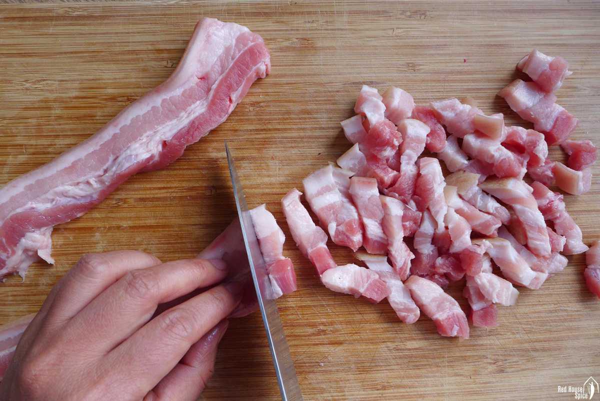 cutting pork belly with a knife