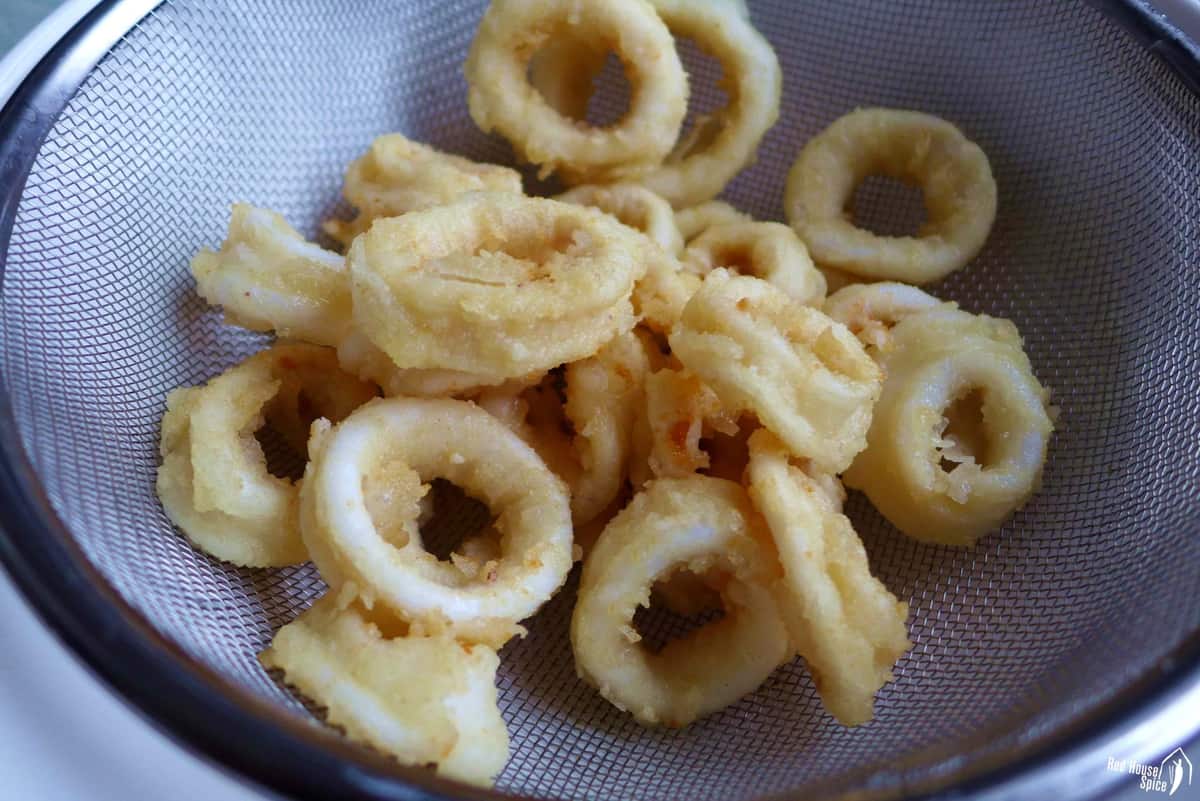 deep fried squid in a colander