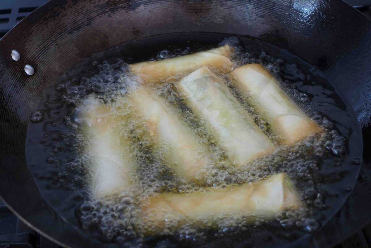 deep frying spring rolls.