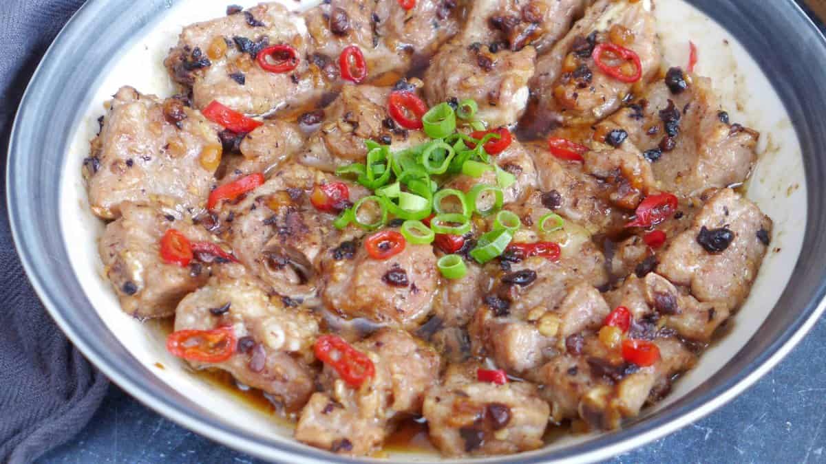 a plate of steamed ribs with fermented black beans and chili pepper.