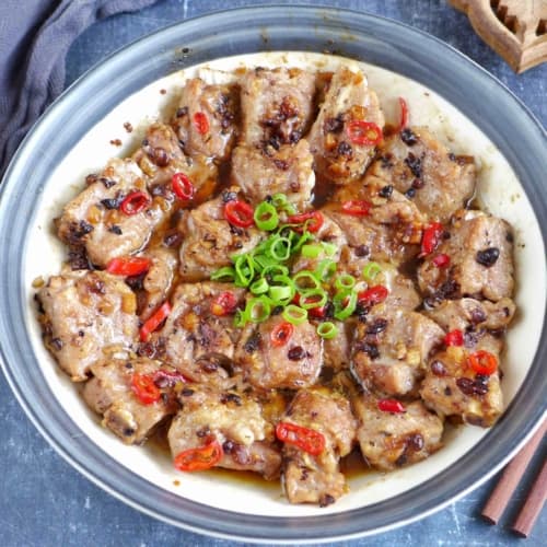 a plate of steamed ribs with fermented black beans and chili pepper.